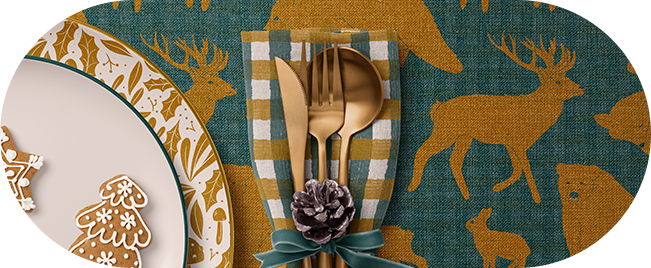 Woodland Theme Tableware: Plates, napkins and table cloths with forest animals on a dining table.